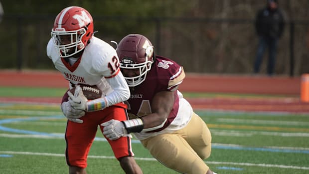 Killingly senior Terrence Allen makes the tackle against Masuk's Gavin Walker during the CIAC Class MM semifinal Sunday at Mo
