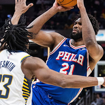 Jan 25, 2024; Indianapolis, Indiana, USA; Philadelphia 76ers center Joel Embiid (21) shoots the ball while Indiana Pacers forward Aaron Nesmith (23) defends in the second half at Gainbridge Fieldhouse. Mandatory Credit: Trevor Ruszkowski-USA TODAY Sports