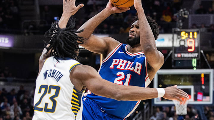 Jan 25, 2024; Indianapolis, Indiana, USA; Philadelphia 76ers center Joel Embiid (21) shoots the ball while Indiana Pacers forward Aaron Nesmith (23) defends in the second half at Gainbridge Fieldhouse. Mandatory Credit: Trevor Ruszkowski-USA TODAY Sports