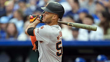 Sep 22, 2024; Kansas City, Missouri, USA; San Francisco Giants center fielder Grant McCray (58) hits an RBI triple during the second inning against the Kansas City Royals at Kauffman Stadium. 