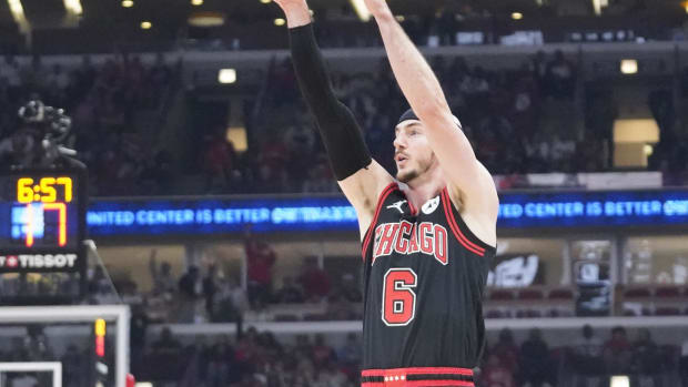 Apr 17, 2024; Chicago, Illinois, USA; Chicago Bulls guard Alex Caruso (6) shoots against the Atlanta Hawks during the first quarter during a play-in game of the 2024 NBA playoffs at United Center. Mandatory Credit: David Banks-USA TODAY Sports