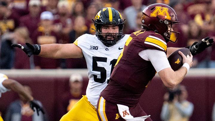 Iowa Hawkeyes defensive lineman Luke Gaffney (51) pressures Minnesota’s Drake Lindsey (5) Oct. 24, 2026 during a Big Ten football game in Minneapolis, Minnesota.