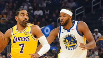 Los Angeles Lakers guard Gabe Vincent (7) dribbles to the basket against Golden State Warriors guard Moses Moody (4) in the first quarter at Chase Center.