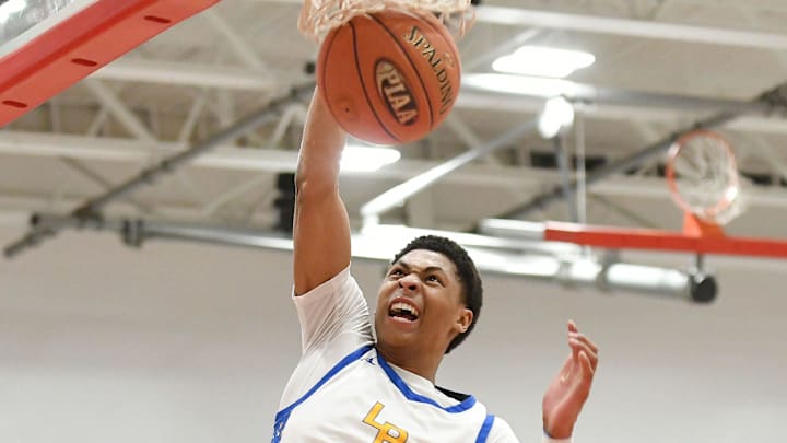 Lincoln Park guard Meleek Thomas dunks the ball during Friday's PIAA Class 4A quarterfinal game against North Catholic at Fox Chapel High School.