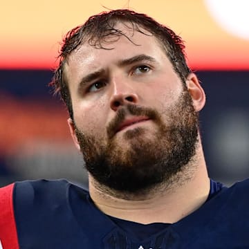 Former Michigan Wolverines standout Andrew Stueber was drafted by the New England Patriots in 2022 and signed with the Atlanta Falcons on Tuesday.