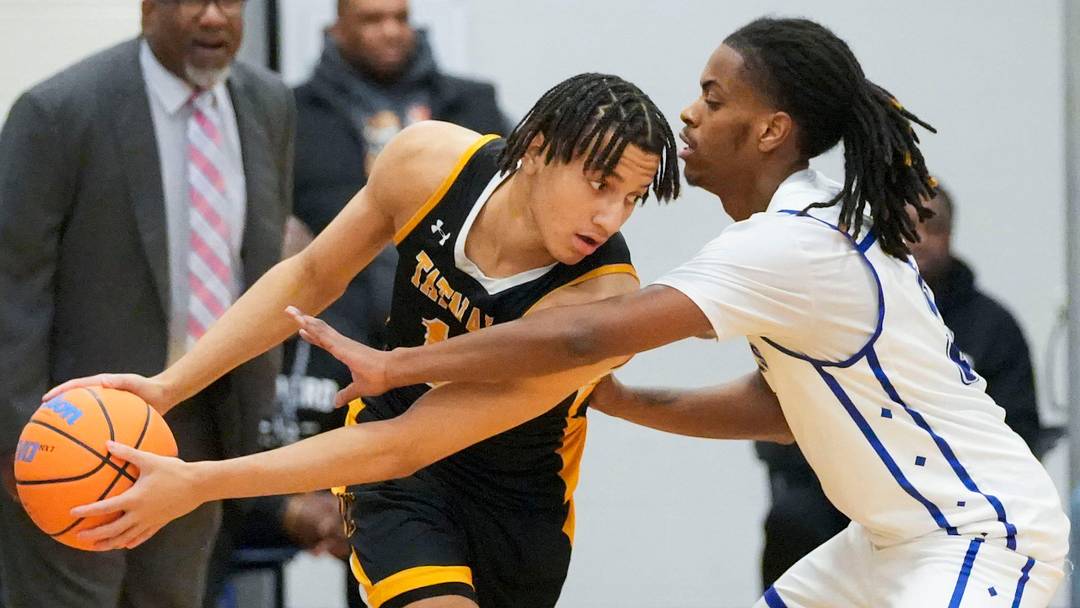 Tatnall’s Mason Collins (left) guards the ball from Howard’s Dominic Awahmukalah in Howard’s 72-62 win in the second round of the DIAA state tournament, March 5, 2026 at Howard.