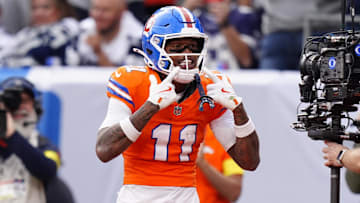 Oct 26, 2025; Denver, Colorado, USA;  Denver Broncos wide receiver Troy Franklin (11) celebrates after scoring a touchdown against the Dallas Cowboys in the fourth quarter at Empower Field at Mile High. Mandatory Credit: Ron Chenoy-Imagn Images