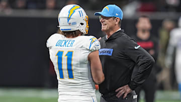 Dec 1, 2024; Atlanta, Georgia, USA; Los Angeles Chargers head coach Jim Harbaugh talks to place kicker Cameron Dicker (11) before the game against the Atlanta Falcons at Mercedes-Benz Stadium. Mandatory Credit: Dale Zanine-Imagn Images
