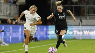 Oct 15, 2023; Washington, District of Columbia, USA; North Carolina Courage forward Brittany Ratcliffe (11) and Washington Spirit defender Gabrielle Carle (14) chase the ball during the second half at Audi Field. Mandatory Credit: Geoff Burke-USA TODAY Sports