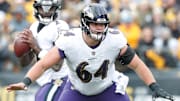 Dec 11, 2022; Pittsburgh, Pennsylvania, USA;  Baltimore Ravens center Tyler Linderbaum (64) in pass protection at the line of scrimmage against the Pittsburgh Steelers during the second quarter at Acrisure Stadium. Mandatory Credit: Charles LeClaire-Imagn Images