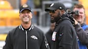 Oct 8, 2023; Pittsburgh, Pennsylvania, USA; Baltimore Ravens head coach John Harbaugh (left) and Pittsburgh Steelers head coach Mike Tomlin meet at mid-field before their game at Acrisure Stadium. Mandatory Credit: Philip G. Pavely-Imagn Images