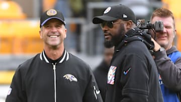 Oct 8, 2023; Pittsburgh, Pennsylvania, USA; Baltimore Ravens head coach John Harbaugh (left) and Pittsburgh Steelers head coach Mike Tomlin meet at mid-field before their game at Acrisure Stadium. Mandatory Credit: Philip G. Pavely-Imagn Images