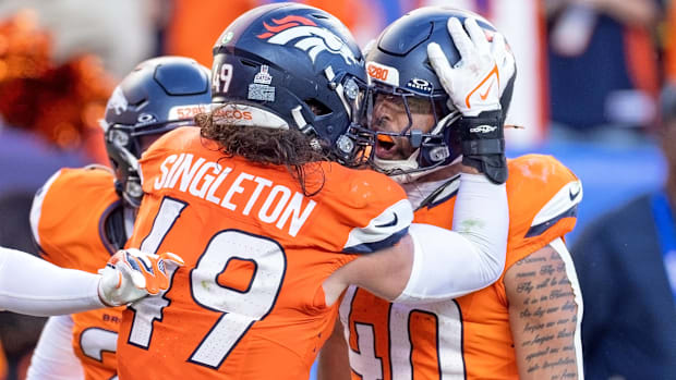 Denver Broncos linebackers Alex Singleton (49) and Justin Strnad (40) celebrate a big play vs. the New York Giants. 