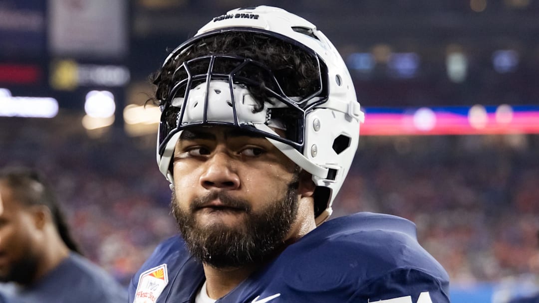 Dec 31, 2024; Glendale, AZ, USA; Penn State Nittany Lions offensive lineman Olaivavega Ioane (71) against the Boise State Broncos during the Fiesta Bowl at State Farm Stadium. Mandatory Credit: Mark J. Rebilas-Imagn Images