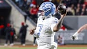Nov 29, 2025; Raleigh, North Carolina, USA;  North Carolina Tar Heels quarterback Gio Lopez (7) prepares to throw the football during the first half of the game against NC State Wolfpack at Carter-Finley Stadium.  Mandatory Credit: Jaylynn Nash-Imagn Images