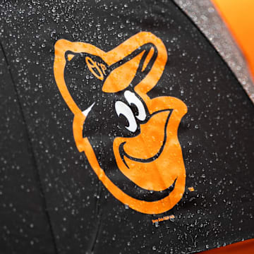 Aug 22, 2021; Baltimore, Maryland, USA; A Baltimore Orioles logo is seen on an umbrella during the game between the Baltimore Orioles and the Atlanta Braves at Oriole Park at Camden Yards. Mandatory Credit: Scott Taetsch-Imagn Images