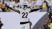 Oct 16, 2025; Cincinnati, Ohio, USA; Cincinnati Bengals safety Geno Stone (22) reacts and Pittsburgh Steelers running back Kenneth Gainwell (14) looks on during the fourth quarter at Paycor Stadium. Mandatory Credit: Katie Stratman-Imagn Images