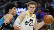 Dec 20, 2022; Detroit, Michigan, USA;  Utah Jazz forward Lauri Markkanen (23) dribbles defended by Detroit Pistons guard Killian Hayes (7) in the second half at Little Caesars Arena. Mandatory Credit: Rick Osentoski-Imagn Images