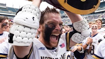 Notre Dame fighting Irish attack Chris Kavanagh (50) celebrates with the Lacrosse championship trophy