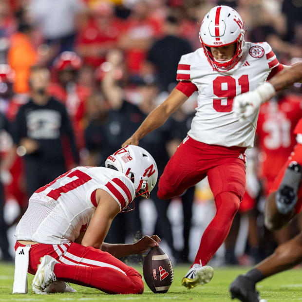 Nebraska place kicker Kyle Cunanan drills a 52-yard field goal in Arrowhead Stadium against Cincinnati.