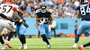 Dec 15, 2024; Nashville, Tennessee, USA;  Tennessee Titans running back Tony Pollard (20) runs the ball against the Cincinnati Bengals during the first half at Nissan Stadium. Mandatory Credit: Steve Roberts-Imagn Images