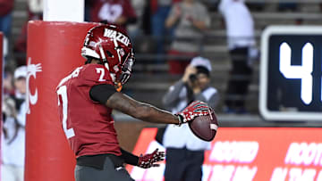 Sep 20, 2024; Pullman, Washington, USA; Washington State Cougars wide receiver Kyle Williams (2) celebrates a touchdown in the second half agains the San Jose State Spartans at Gesa Field at Martin Stadium. Washington State Cougars won 54-52 in double overtime. Mandatory Credit: James Snook-Imagn Images