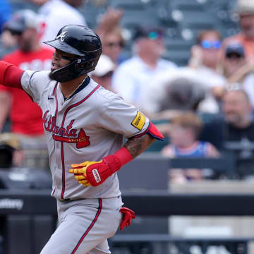 Atlanta Braves shortstop Orlando Arcia rounds the bases after hitting a solo home run against the New York Mets.