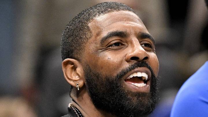 Dallas Mavericks guard Kyrie Irving (11) laughs with his teammates during the game between the Mavericks and the Nets at the American Airlines Center on Dec 12, 2025.