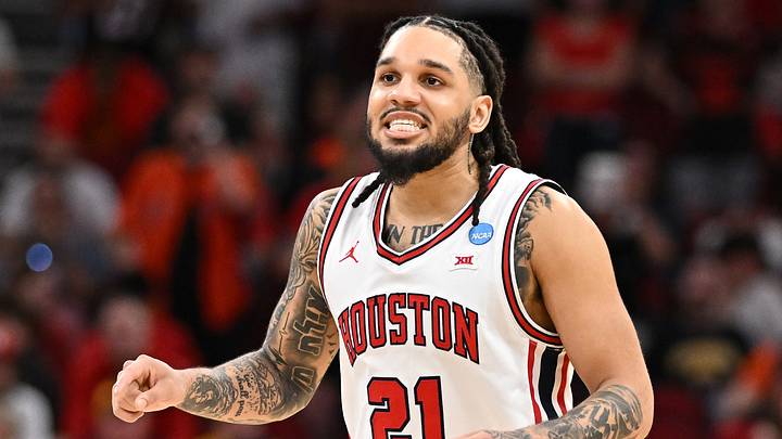 Mar 26, 2026; Houston, TX, USA; Houston Cougars guard Emanuel Sharp (21) reacts in the second half during a Sweet Sixteen game of the South Regional of the men's 2026 NCAA Tournament at Toyota Center. Mandatory Credit: Maria Lysaker-Imagn Images