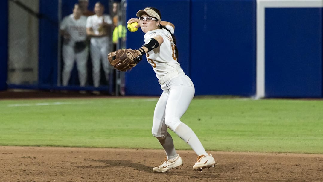 Jun 6, 2025; Oklahoma City, OK, USA;  Texas Longhorns utility Leighann Goode (43) throws to first to make the final out in the game in the seventh inning against the Texas Tech Red Raiders to win the National Championship 10-4 in game three of the NCAA Softball Women's College World Series finals at Devon Park. Mandatory Credit: Brett Rojo-Imagn Images