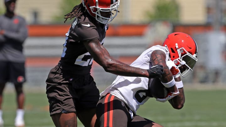 Browns wide receiver Elijah Moore turns up the field against cornerback Martin Emerson Jr. during minicamp, Tuesday, June 11, 2024, in Berea.