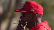 Angels manager Ron Washington smokes a cigarette during a Spring Training workout at Tempe Diablo Stadium on Feb. 16, 2024.