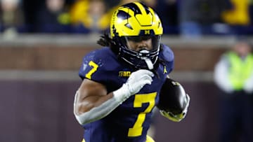 Nov 23, 2024; Ann Arbor, Michigan, USA;  Michigan Wolverines running back Donovan Edwards (7) rushes against the Northwestern Wildcats at Michigan Stadium
