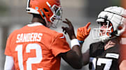 Jul 26, 2025; Berea, OH, USA; Cleveland Browns quarterback Shedeur Sanders (12) celebrates with wide receiver Luke Floriea (37) during training camp at CrossCountry Mortgage Campus. Mandatory Credit: Ken Blaze-Imagn Images