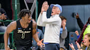 Jan 21, 2024; New Orleans, Louisiana, USA;  Tulane Green Wave guard Sion James (1) celebrates a three point basket with fans during the second half against the Memphis Tigers at Avron B. Fogelman Arena in Devlin Fieldhouse. Mandatory Credit: Matthew Hinton-Imagn Images