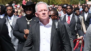 Sep 14, 2024; Fayetteville, Arkansas, USA; Arkansas Razorbacks offensive coordinator Bobby Petrino during the Hog walk prior to the game agains the UAB Blazers at Donald W. Reynolds Razorback Stadium. Mandatory Credit: Nelson Chenault-Imagn Images