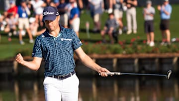 Justin Thomas made his 11th birdie at the 17th hole en route to a course-record-tying 62 Friday at TPC Sawgrass.