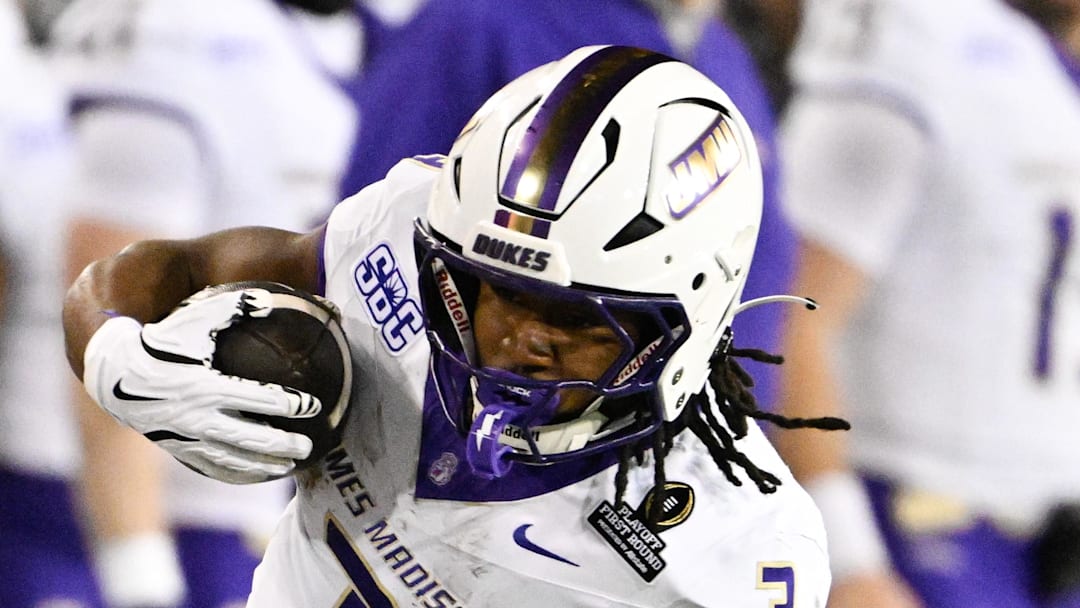 Dec 20, 2025; Eugene, OR, USA; James Madison Dukes running back Wayne Knight (3) rushes during the second quarter against the Oregon Ducks at Autzen Stadium. Mandatory Credit: Troy Wayrynen-Imagn Images