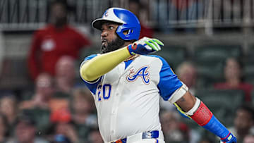 Aug 9, 2025; Cumberland, Georgia, USA; Atlanta Braves designated hitter Marcell Ozuna (20) bats against the Miami Marlins during the sixth inning at Truist Park. Mandatory Credit: Dale Zanine-Imagn Images