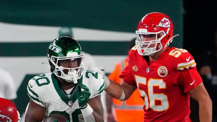 Oct 1, 2023; East Rutherford, New Jersey, USA; New York Jets running back Breece Hall (20) runs past Kansas City Chiefs linebacker Drue Tranquill (23) in the second half at MetLife Stadium. Mandatory Credit: Robert Deutsch-Imagn Images