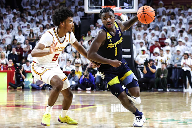 Iowa State Cyclones guard Curtis Jones (5) defends Marquette Golden Eagles guard Kam Jones.