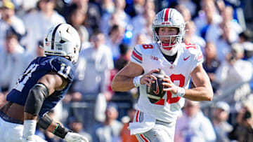 Ohio State Buckeyes quarterback Will Howard (18) looks to pass over Penn State Nittany Lions defensive end Abdul Carter (11) during the NCAA football game at Beaver Stadium in University Park, Pa. on Monday, Nov. 4, 2024. Ohio State won 20-13.