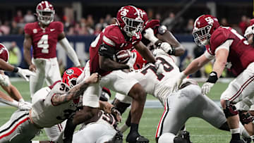 Dec 2, 2023; Atlanta, GA, USA; Alabama Crimson Tide running back Jam Miller (26) rushes the ball against the Georgia Bulldogs during the first half in the SEC Championship game at Mercedes-Benz Stadium. Mandatory Credit: Dale Zanine-Imagn Images
