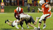 Oct 18, 2025; Charlottesville, Virginia, USA; Virginia Cavaliers running back Harrison Waylee (21) fumbles the ball after a hit by Washington State Cougars safety Cale Reeder (25) in the fourth quarter at Scott Stadium. Mandatory Credit: Geoff Burke-Imagn Images