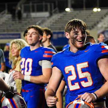 Bolles running back Xander Edwards (25) celebrates the Bulldogs' win over Cardinal Gibbons in the FHSAA Class 2A semifinal at Bolles School in Jacksonville on Dec. 5, 2025. Bolles will take on Sarasota Cardinal Mooney for the state title on Wednesday, Dec. 10, in Miami,