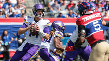 Sep 8, 2024; East Rutherford, New Jersey, USA; Minnesota Vikings quarterback Sam Darnold (14) drops back to pass during the first quarter against the New York Giants at MetLife Stadium. Mandatory Credit: Vincent Carchietta-Imagn Images