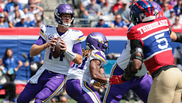 Sep 8, 2024; East Rutherford, New Jersey, USA; Minnesota Vikings quarterback Sam Darnold (14) drops back to pass during the first quarter against the New York Giants at MetLife Stadium. Mandatory Credit: Vincent Carchietta-Imagn Images