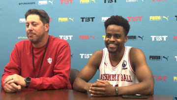 Assembly Ball coach Adam Ross (left) and point guard Yogi Ferrell discuss Sunday's 68-55 win over Men of Mackey in The Basketball Tournament.