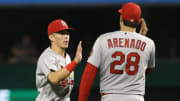 Aug 27, 2021; Pittsburgh, Pennsylvania, USA; St. Louis Cardinals second baseman Tommy Edman (19) and third baseman Nolan Arenado (28) celebrate after defeating the Pittsburgh Pirates at PNC Park. The Cardinals won 4-3. Mandatory Credit: Charles LeClaire-USA TODAY Sports