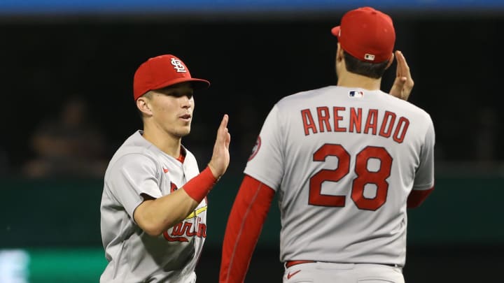 Aug 27, 2021; Pittsburgh, Pennsylvania, USA; St. Louis Cardinals second baseman Tommy Edman (19) and third baseman Nolan Arenado (28) celebrate after defeating the Pittsburgh Pirates at PNC Park. The Cardinals won 4-3. Mandatory Credit: Charles LeClaire-USA TODAY Sports